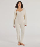 The Dressed To Lounge Chenille Knit Catsuit in ivory is a sleek women's catsuit featuring a chic, body-hugging silhouette with on-trend details for a striking profile, perfect for creating winter going-out looks or holiday party outfits.