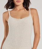 The Dressed To Lounge Chenille Knit Catsuit in ivory is a sleek women's catsuit featuring a chic, body-hugging silhouette with on-trend details for a striking profile, perfect for creating winter going-out looks or holiday party outfits.
