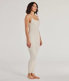 The Dressed To Lounge Chenille Knit Catsuit in ivory is a sleek women's catsuit featuring a chic, body-hugging silhouette with on-trend details for a striking profile, perfect for creating winter going-out looks or holiday party outfits.
