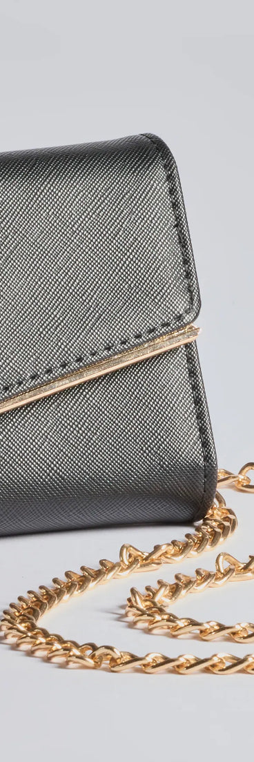 The Classically Chic Faux Leather Envelope Wristlet in black is a women's workwear piece offering a trendy style and unique accents, perfect for effortlessly creating an outfit-of-the-day look that transitions your office look to going-out ready.