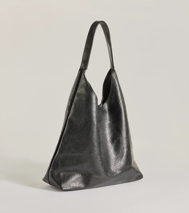 The Iconic Moment Faux Leather Slouchy Shoulder Bag in black is a women's workwear essential with an elevated fabric and chic silhouette, ideal for layering and versatile enough to take your look from office chic to going-out ready!