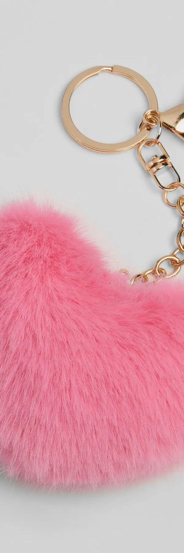 Whether you're dressing up for a romantic date or a Galentine's event, the Soft At Heart Faux Fur Plush Keychain in pink is the perfect accessory to elevate your Valentine's Day outfit.