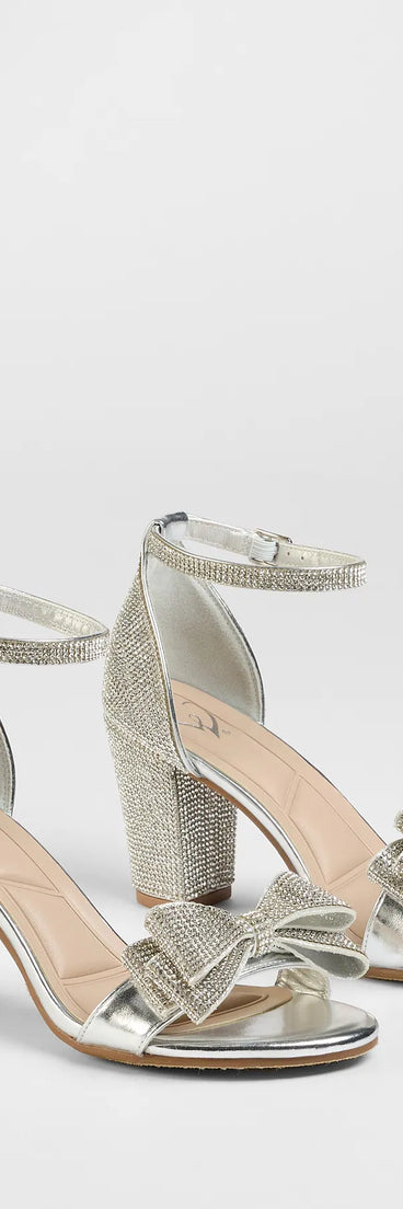 Step into style with the Endless Glam Rhinestone Bow Block Heels, silver heels made to complete your Windsor look with comfort and glam in mind.
