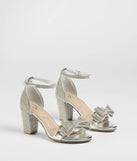 Get ready for any event with the Endless Glam Rhinestone Bow Block Heels in silver, an essential start to creating a versatile holiday outfit for women for holiday parties, cocktail hours, or NYE events.