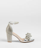 Get ready for any event with the Endless Glam Rhinestone Bow Block Heels in silver, an essential start to creating a versatile holiday outfit for women for holiday parties, cocktail hours, or NYE events.