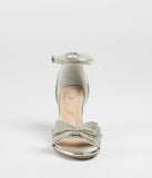 Get ready for any event with the Endless Glam Rhinestone Bow Block Heels in silver, an essential start to creating a versatile holiday outfit for women for holiday parties, cocktail hours, or NYE events.