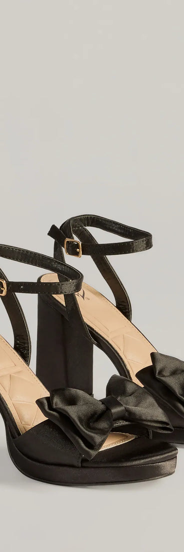 The Icon Era Satin Bow Strap Platform Heels in black is an elevated pick for your best outfit yet, effortlessly delivering a polished look that's sure to turn heads at any celebration.