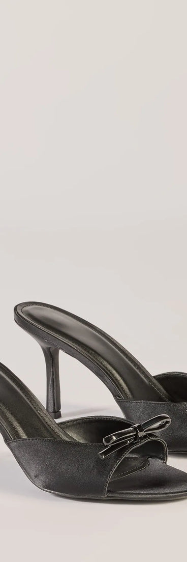 Elevate your work wardrobe with the Chic Elegance Faux Leather Stiletto Bow Mules in black, a versatile women's shoe perfect for the office; that combines style with comfort for seamless desk-to-dinner transitions.