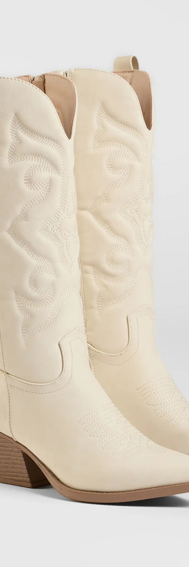 The Country Daze Under-The-Knee Cowboy Boots in ivory brings edge and energy to your vibe, ready to elevate any festival look or concert outfit.