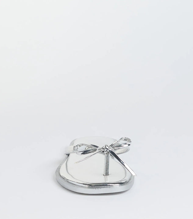 Elevate warm-weather looks with Dainty Looks Bow Thong Sandals in silver, a pair of trendy sandals bringing chic, modern flair to every step.