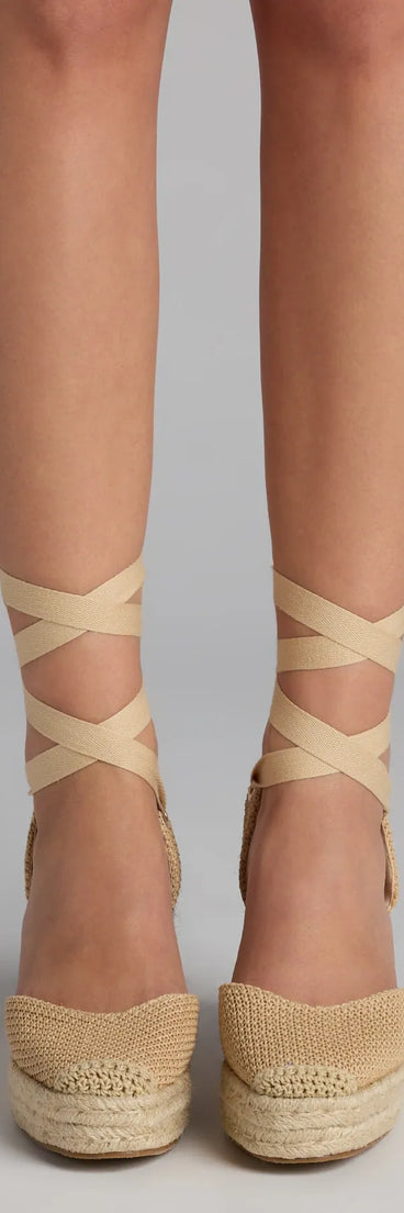 Elevate warm-weather looks with Weekend Getaway Lace-Up Espadrille Wedges in tan, a pair of trendy sandals bringing chic, modern flair to every step.