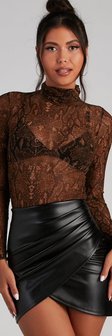 Sexy Slither Mesh Turtleneck Top creates the perfect New Year’s Eve Outfit or new years dress with stylish details in the latest trends to ring in 2023!