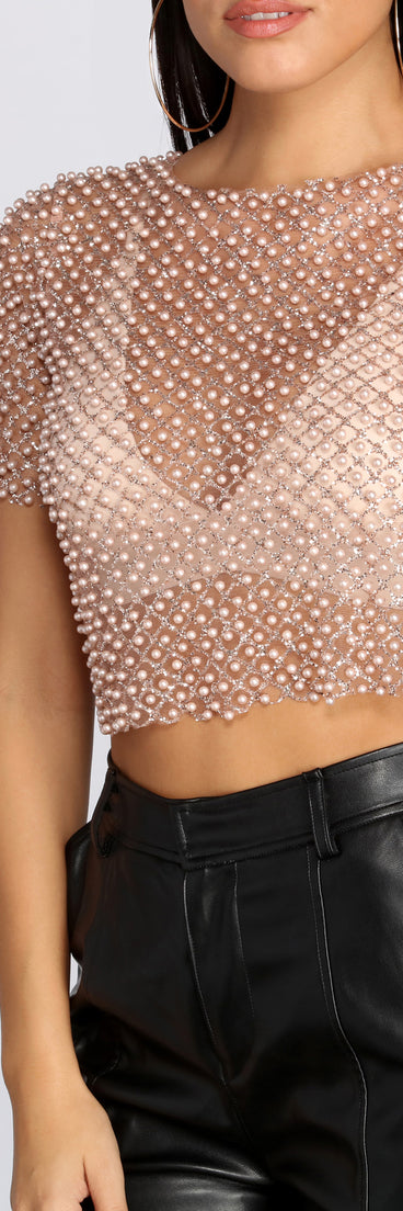 With fun and flirty details, Sparkly Dreams Sheer Crop Top shows off your unique style for a trendy outfit for the summer season!