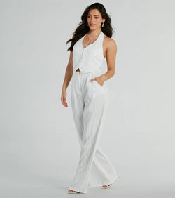 The Getaway Vibes Wide-Leg Pinstripe Woven Jumpsuit is an elevated one-piece that blends sleek sophistication with playful charm, perfect for nailing casual or formal outfits.