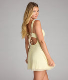 A stunning pick for an engagement photoshoot outfit or autumn wedding guest dress, this fall formal dress showcases the Ailani Lace-Up Beaded Skater Dress in yellow with a graceful silhouette that captures the moment.