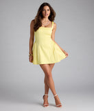 A stunning pick for an engagement photoshoot outfit or autumn wedding guest dress, this fall formal dress showcases the Selma Short A-Line Dress in yellow with a graceful silhouette that captures the moment.
