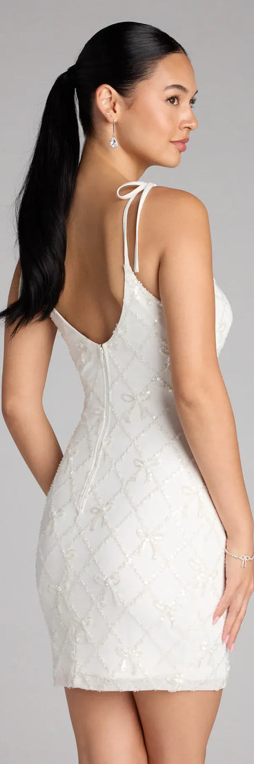 Style your seasonal looks with the Marleen Sequin Pearl Bow Mini Dress, a trend-right, white fall dress designed for any plan on your calendar with new and unqiue details.