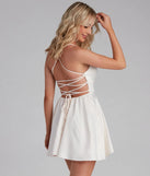 Step into winter chic with the Sonya Satin Dress, a ivory mini dress featuring an above-the-knee cut ideal for cocktail parties, festive gatherings, or clubwear.