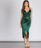 Turn heads at Prom 2025 in this hunter green prom dress, where statement-making details meet the iconic style of the Amanda Wrap Satin Dress .