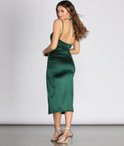 Revamp your 2025 wardrobe with this chic addition, the Amanda Wrap Satin Dress in hunter green, perfect for elevating your style in the new year.