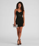 Kerrie Heatstone V-Neck Party Dress, a trendy black mini dress featuring modern details and a fresh seasonal hue, perfect for creating chic 2025 looks.