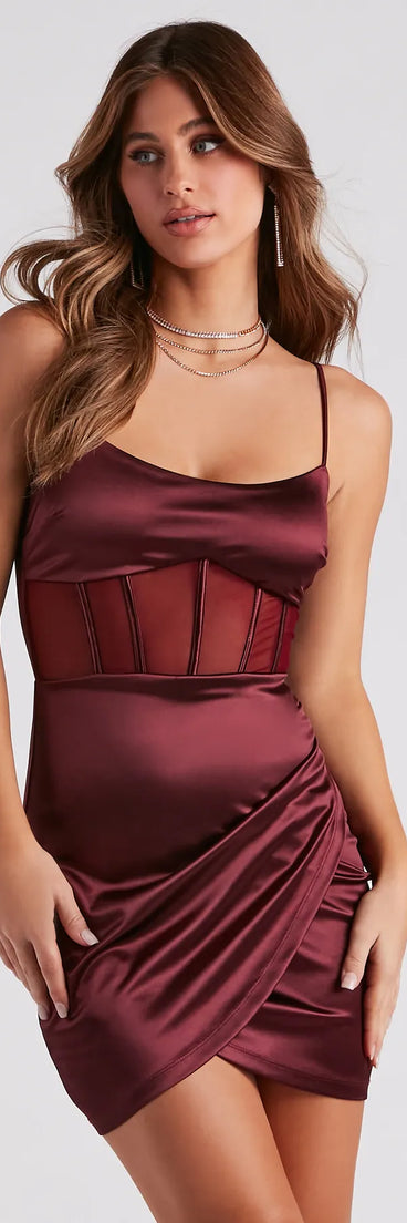 Turn heads at Prom 2025 in this maroon prom dress, where statement-making details meet the iconic style of the Paris Satin Corset Mini Dress .