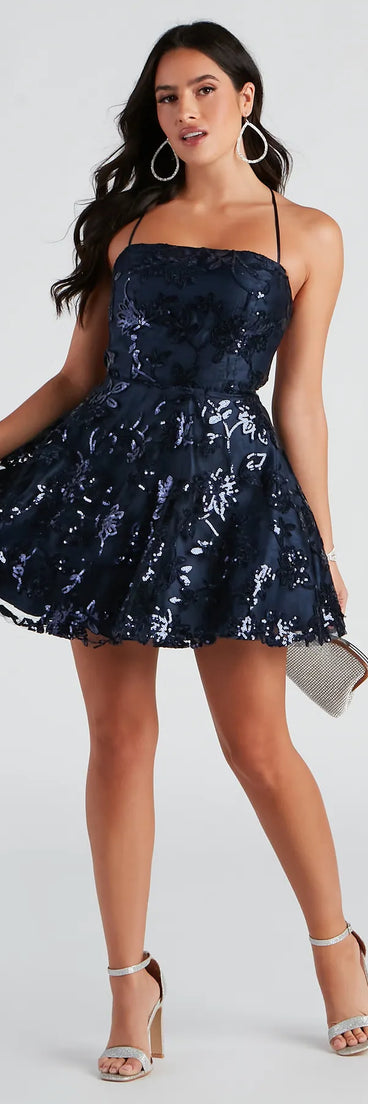 Turn heads in the beaming Joanna Sequin Lace Party Dress, a stunning navy sequin dress designed to add sparkle and elegance to your next night out or special occasion.