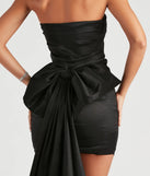 The Lucy Taffeta Bow Mini Party Dress is a show-stopping black prom dress, offering a sleek, slimming silhouette that enhances your natural beauty for an unforgettable night.