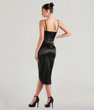The Margaret Formal Satin Wrap Midi Dress helps create a chic women's black cocktail outfit with a trendy texture and stylish design, ideal for wedding guest cocktail outfits or dinner parties