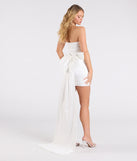 The Lucy Taffeta Bow Mini Party Dress in white brings sleek style to any graduation outfit, from cap and gown to after-party.