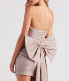 Marcy Glitter Bow Mini Party Dress, a trendy blush mini dress featuring modern details and a fresh seasonal hue, perfect for creating chic 2025 looks.