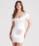 Step into winter chic with the Lexie Rhinestone Satin Puff Sleeve Bodycon Mini Dress, a white mini dress featuring an above-the-knee cut ideal for cocktail parties, festive gatherings, or clubwear.