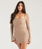 Turn heads at Prom 2025 in this nude prom dress, where statement-making details meet the iconic style of the Kim Rhinestone And Pearl Formal Bodycon Mini Dress .