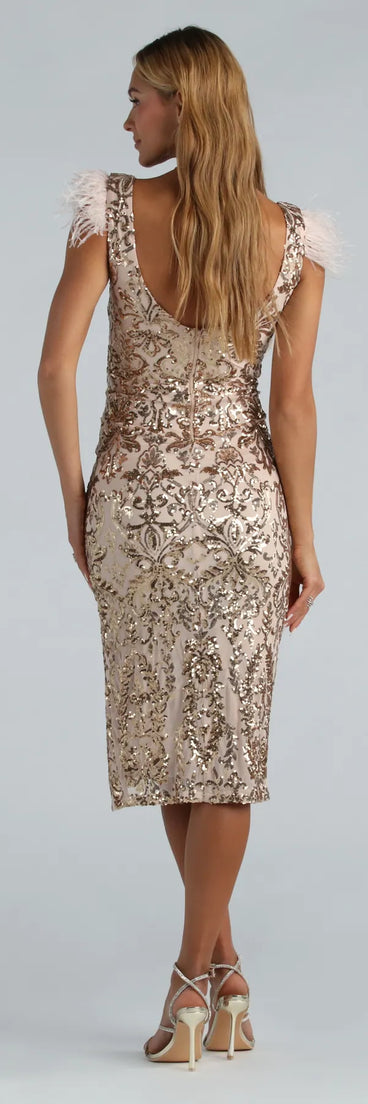 Shine bright in the Ada Formal Sequin Feather Midi Dress, a glamorous gold sequin dress that captures the light beautifully, ideal for a New Year's Eve dress, wedding guest dress, or a festive party look.