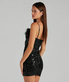 The Sarahi Sequin Rose Marabou Mini Dress is a black holiday dress with a festive style, crafted from luxe fabrics and with unique design accents, a perfect pick as your holiday party dress.