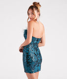 The Neriah Sequin Marabou Feather Party Dress in teal is a stunning green prom dress designed to capture attention with its fresh or bold color and effortlessly stylish silhouette.