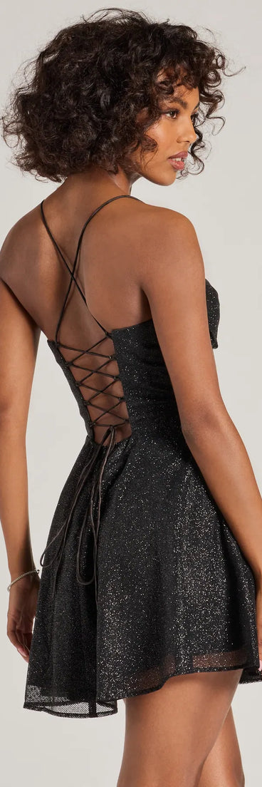 Own every entrance in the Leah Glitter Mesh Corset Skater Dress, a black party dress perfect for milestone birthdays and grad parties, or dancing through autumn nights and unforgettable bachelorette celebrations.