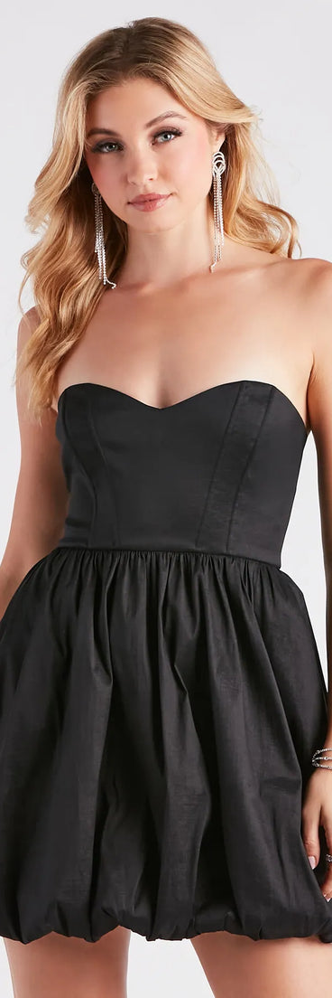 Step into seasonal chic with the Colleen Taffeta Strapless Bubble Hem Dress, a multi-color mini dress featuring an above-the-knee cut ideal for cocktail parties, festive gatherings, or clubwear.