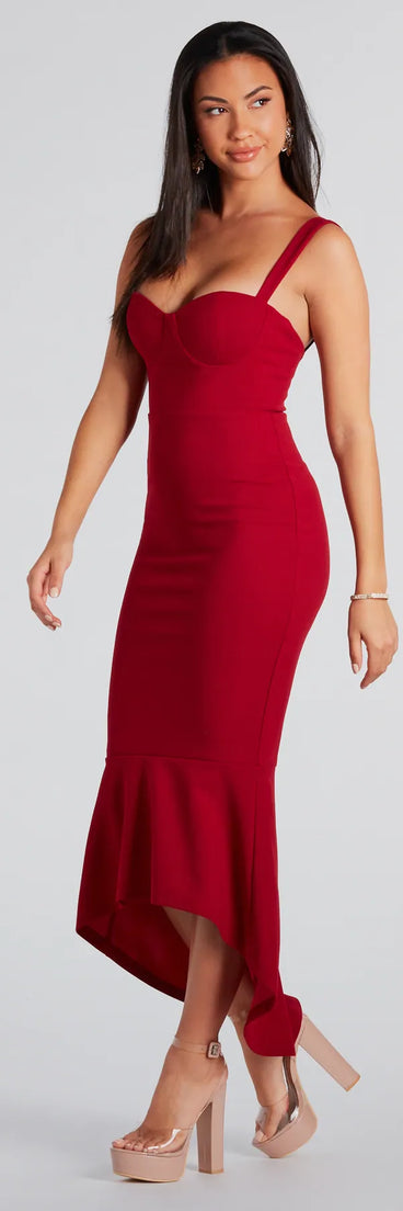 The Ramona Formal High-Low Ruffled Mermaid Dress in burgundy is a modern red dress featuring trendy details and a stunning design ideal for wedding guest dresses, elegant cocktail looks, or an alluring Valentine’s Day dress.