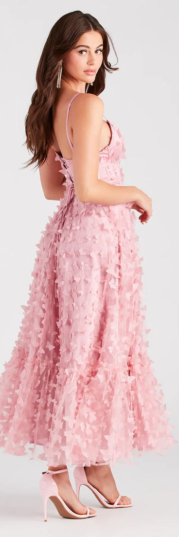 Celebrate the winter holidays in a pink long dress like the Molly Formal Butterfly Applique A-Line Dress, designed with timeless charm for party-ready occasions from winter bridesmaid looks to Winter Formal dances.