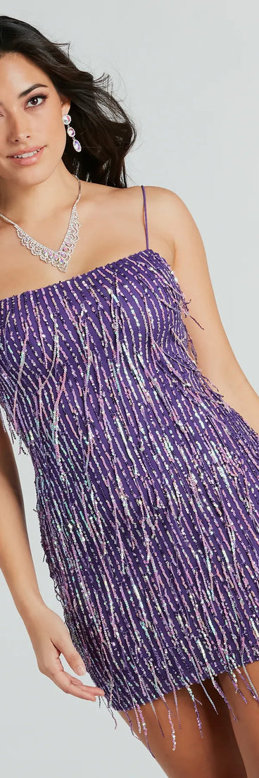 Turn heads in the beaming Khloe Sequin Fringe Party Dress, a stunning purple sequin dress designed to add sparkle and elegance to your next night out or special occasion.