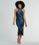 Turn heads at Prom 2025 in this navy blue prom dress, where statement-making details meet the iconic style of the Ingrid Formal Satin Halter Dress .