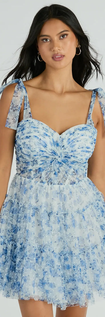 Shine with confidence, elegance, and standout style in the Brynne Formal Floral Mesh Ruffled Skater Dress—a blue homecoming dress designed with a fresh silhouette and the latest trends.