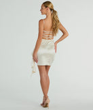 Feel instantly put-together in the Josie Ruffle Detail Satin Mini Dress in ivory, a summer wedding guest dress designed for confident style and all-out celebration.
