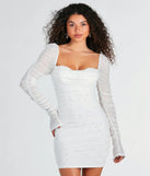 Step into seasonal chic with the Tracey Mesh Faux Pearl Bodycon Party Dress, a white mini dress featuring an above-the-knee cut ideal for cocktail parties, festive gatherings, or clubwear.