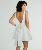 Revamp your 2025 wardrobe with this chic addition, the Brenda Low Back Bow Taffeta Skater Dress in white, perfect for elevating your style in the new year.