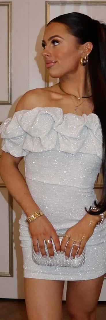 A stunning pick for an engagement photoshoot outfit or autumn wedding guest dress, this fall formal dress showcases the Ember Off-The-Shoulder Ruffle Glitter Party Dress in white with a graceful silhouette that captures the moment.