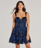 Step into winter chic with the Michelle Corset Sequin Applique Ruffle Skater Dress, a navy mini dress featuring an above-the-knee cut ideal for cocktail parties, festive gatherings, or clubwear.