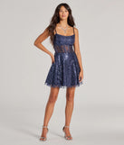 The Angelica Lace-Up Corset Glitter Tulle Skater Dress is a dazzling multicolor sequin dress, perfect for making a bold entrance at any event, from cocktail parties to formal celebrations.