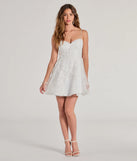 The Chloe Sequin Embroidered Mesh Skater Dress is a dazzling white sequin dress, perfect for making a bold entrance at any event, from cocktail parties to formal celebrations.